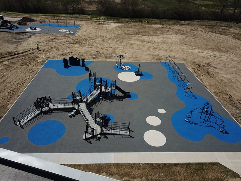 playground with blue rubber mulch